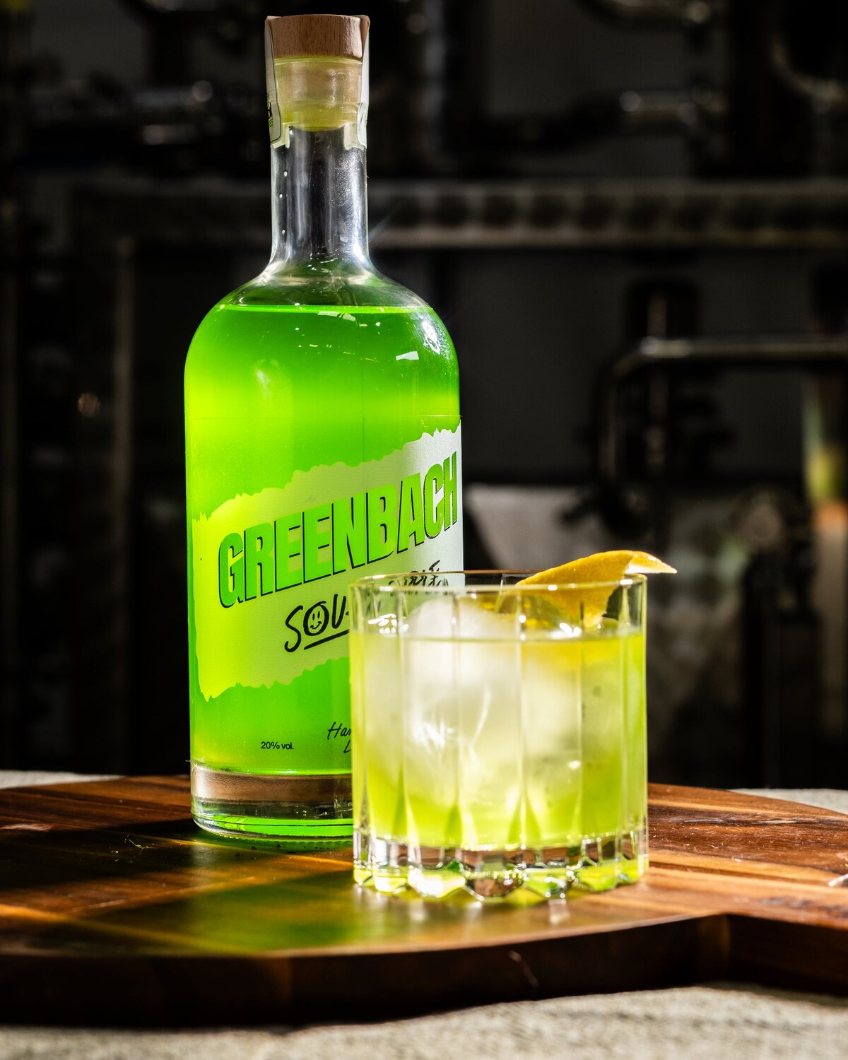 The NeGreeni in a rocks glass with a lemon twist, bottle behind